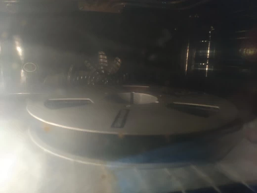 Baking the tape at a low temperature for several hours to dry it. The restored tape could then be played normally for a few days
