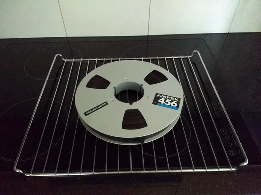 Preparing the tape for baking to temporarily reverse sticky-shed syndrome effects
